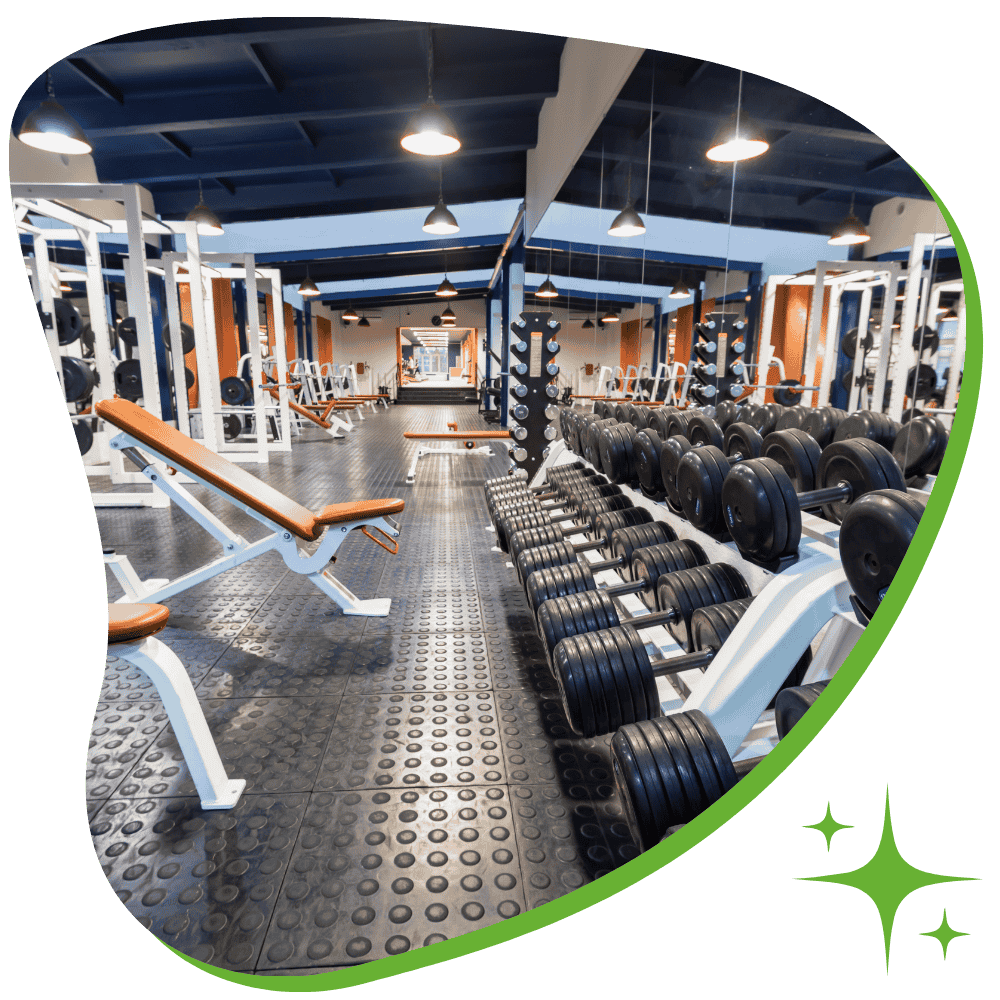 Professional gym cleaning service in Scranton sanitizing exercise equipment and flooring in a fitness center