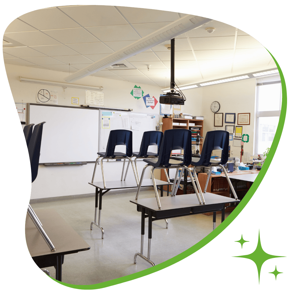 School cleaning service in Scranton sanitizing desks and high-touch surfaces in a classroom